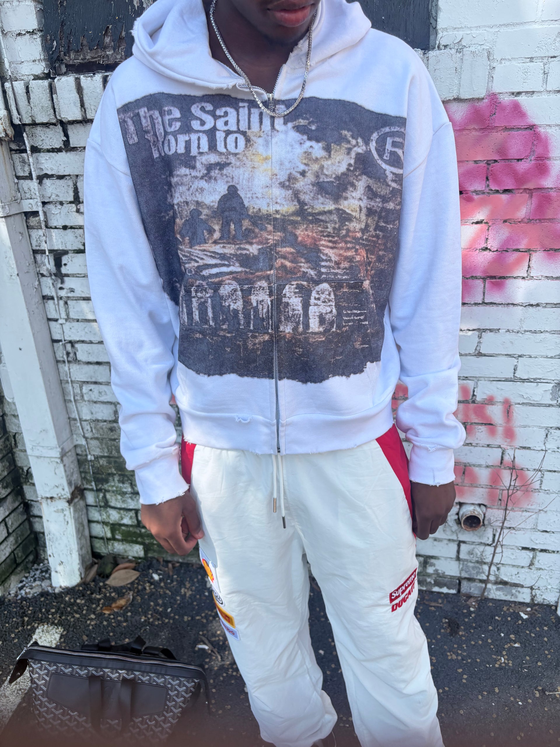 “THE SAINT BORN TO WAR ZIPUP”